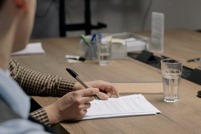 person signing a document (14)
