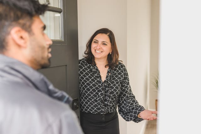 Person opening a door for landlord