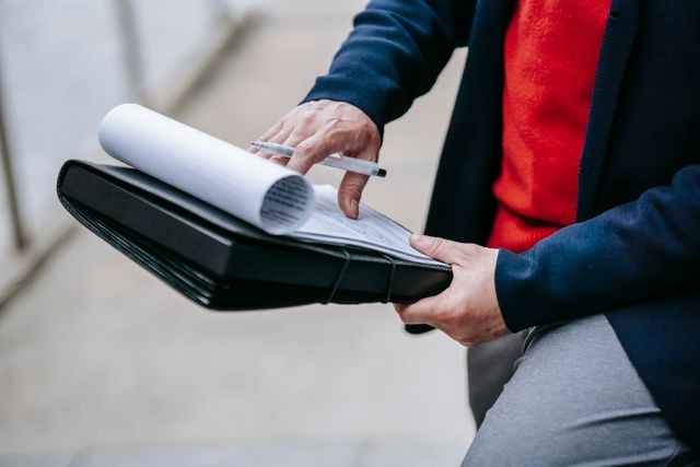 person looking at documents