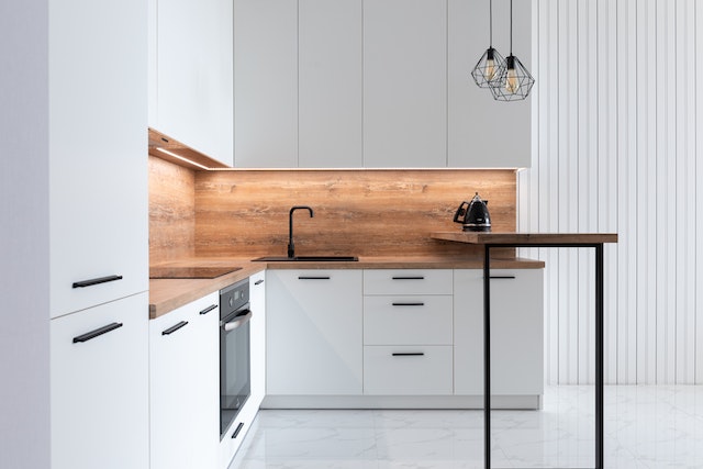 modern-white-kitchen-wooden-counters-rental-renovation