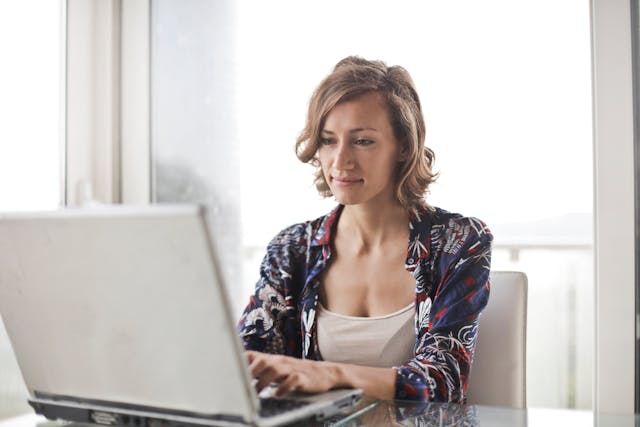 person typing on a laptop 