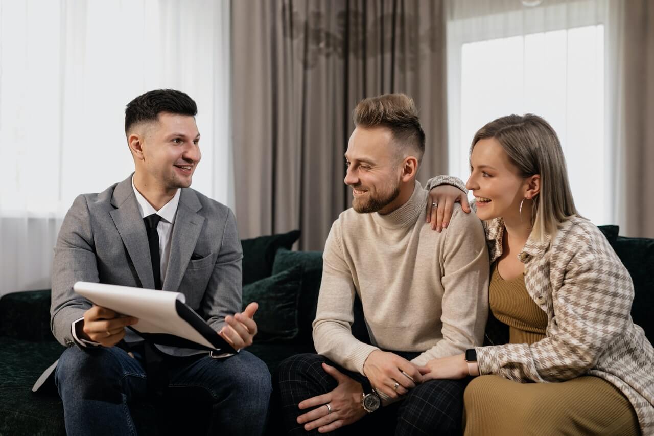 couple discussing with landlord